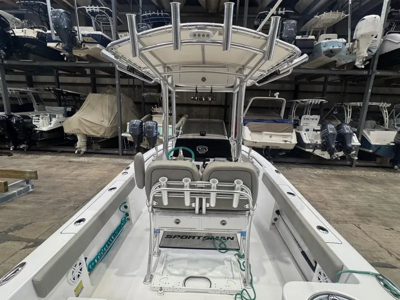 Slide: The Image of 2023 Sportsman 212 boat interior with seating and storage, displayed in a showroom. - 5