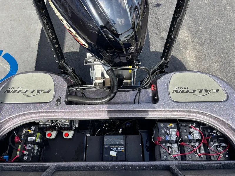 Slide: The Image of 2025 Falcon Boats 21 Predator interior with two seats, outdoor dealership setting. - 14