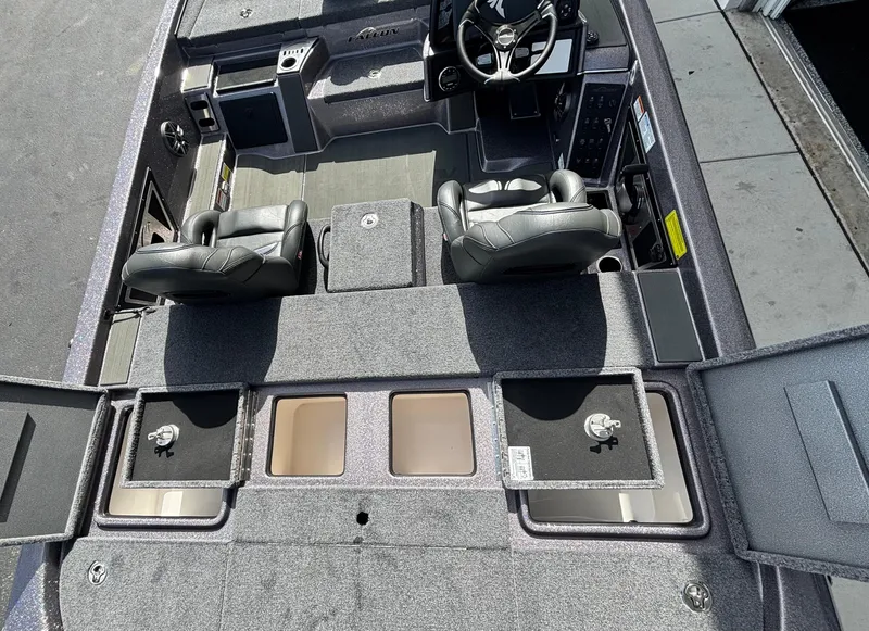 Slide: The Image of 2025 Falcon Boats 21 Predator deck view with storage compartments and trolling motor. - 19