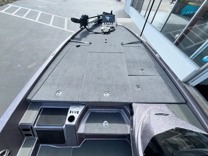 Slide: The Image of 2025 Falcon Boats 21 Predator with open storage compartments, showcasing spacious interior design. - 20