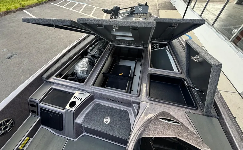 Slide: The Image of Storage compartments in a 2025 Falcon Boats 21 Predator, showcasing organized interior space. - 21