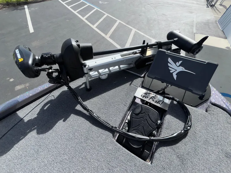 Slide: The Image of 2025 Falcon Boats 21 Predator deck with trolling motor and control panel. - 30