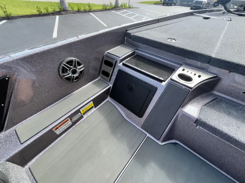 Slide: The Image of Open storage compartment on 2025 Falcon Boats 21 Predator, featuring "Go Fish!" text. - 23