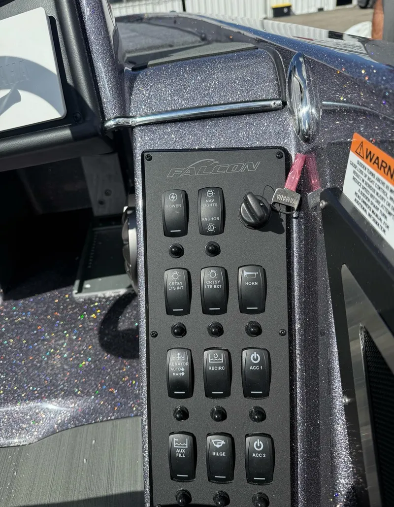 Slide: The Image of Trolling motor and control panel on 2025 Falcon Boats 21 Predator deck. - 29