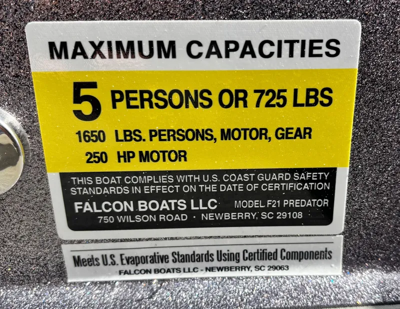 Slide: The Image of 2025 Falcon Boats 21 Predator covered on trailer under blue sky. - 32