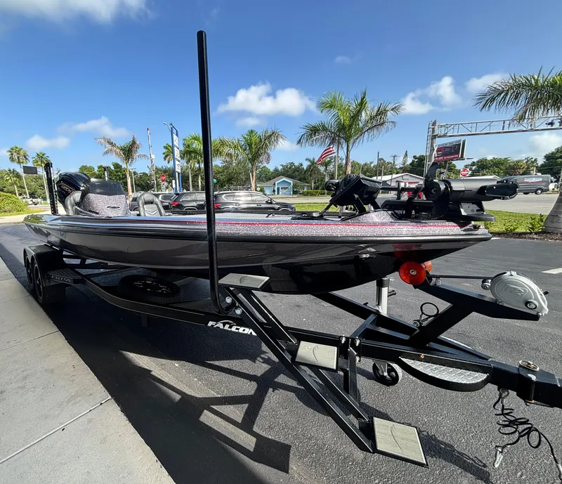 Slide: The Image of 2025 Falcon Boats 21 Predator on trailer, showcasing sleek hull design under clear sky. - 4