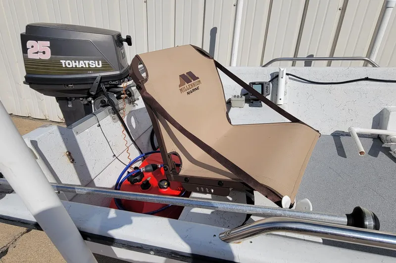 Slide: The Image of 1996 DILKES STUMP JUMPER boat with Tohatsu 25 motor and Millennium Marine seat. - 2