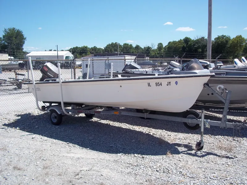Slide: The Image of 1996 Tracker Pro Angler V 16 boat on trailer, parked outdoors. - 20