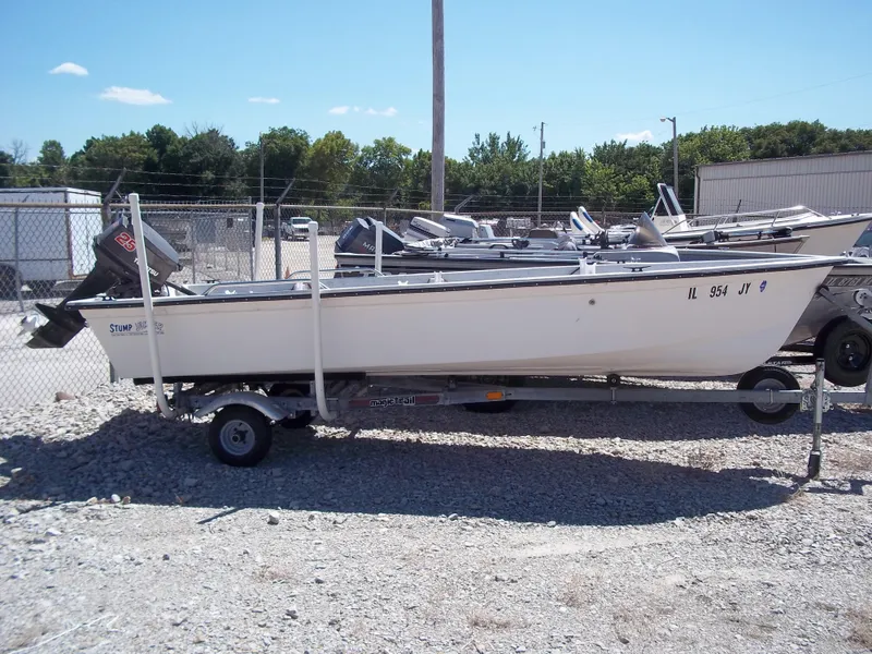 Slide: The Image of 1996 Tracker Pro Angler V 16 boat on trailer, parked on gravel lot. - 21