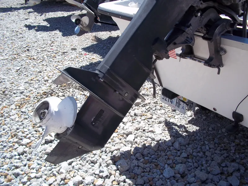 Slide: The Image of 1996 Tracker Pro Angler V 16 boat motor on gravel surface. - 24