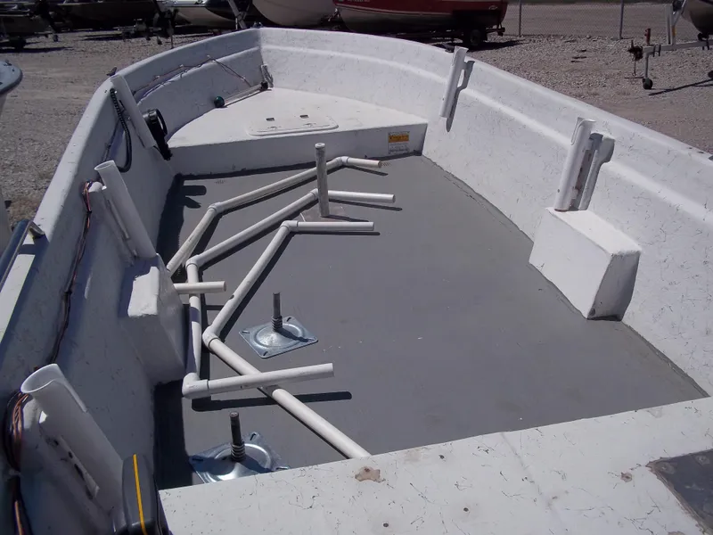 Slide: The Image of 1996 Tracker Pro Angler V 16 boat interior with rod holders and storage compartments. - 28