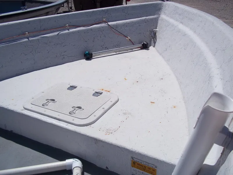 Slide: The Image of 1996 Tracker Pro Angler V 16 boat interior with storage hatch and wiring. - 29