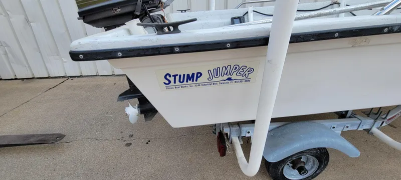 Slide: The Image of 1996 Tracker Pro Angler V 16 boat with "Stump Jumper" decal on trailer. - 4