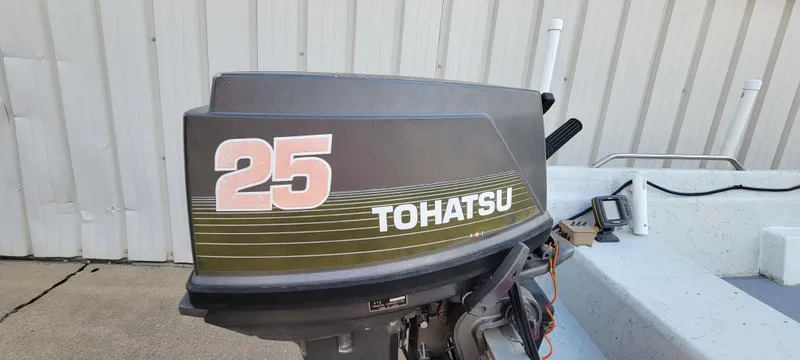 Slide: The Image of Tohatsu 25 outboard motor on 1996 Tracker Pro Angler V 16 boat. - 5