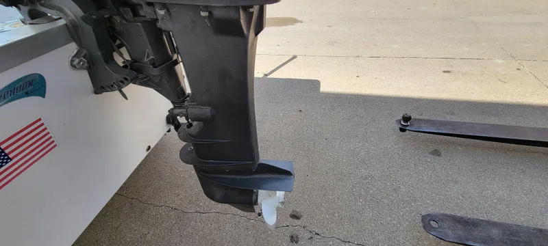 Slide: The Image of 1996 Tracker Pro Angler V 16 boat motor and propeller on concrete surface. - 6