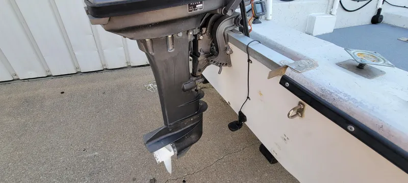 Slide: The Image of 1996 Tracker Pro Angler V 16 boat motor and transom detail. - 7