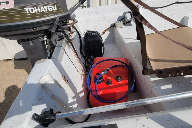 Slide: The Image of 1996 DILKES STUMP JUMPER boat with Tohatsu motor and red fuel tank. - 9