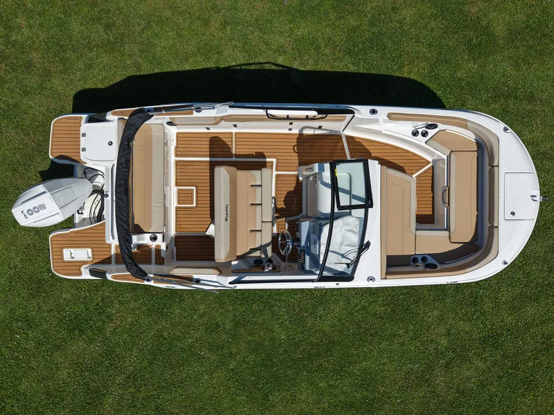 Slide: The Image of 2026 Bayliner Trophy T22SC boat, aerial view, on grass, showcasing spacious interior and seating. - 20