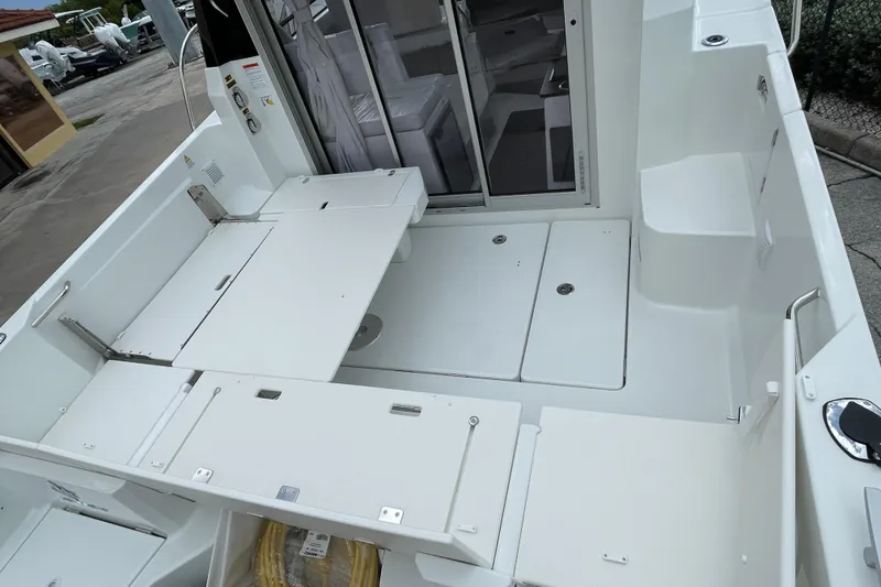 Slide: The Image of Interior of 2026 Jeanneau NC 795 Weekender with seating and table setup. - 10