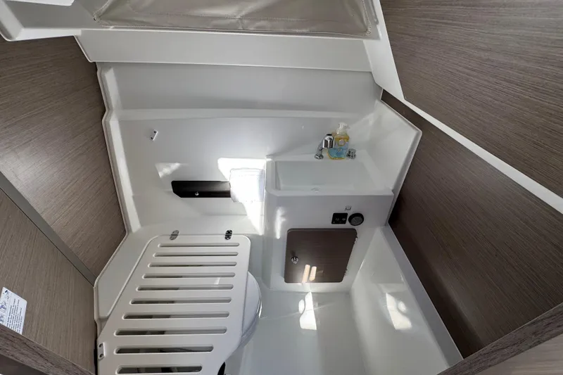 Slide: The Image of 2026 Jeanneau NC 795 Weekender interior bathroom with sink and modern fixtures. - 16