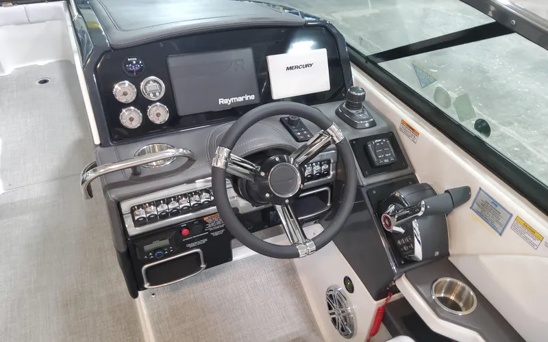Slide: The Image of 2026 Formula 290 Bowrider dashboard with steering wheel, Raymarine display, and Mercury controls. - 12