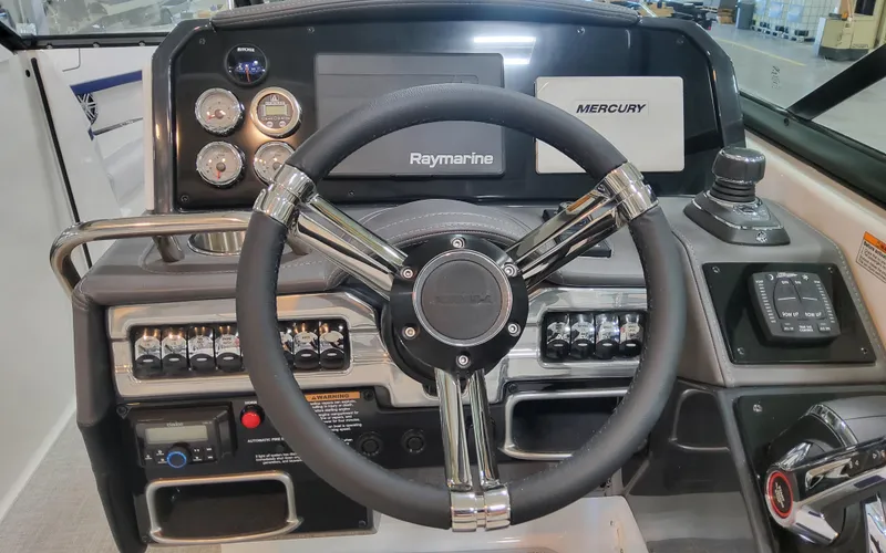 Slide: The Image of 2026 Formula 290 Bowrider dashboard with steering wheel and control panel. - 13