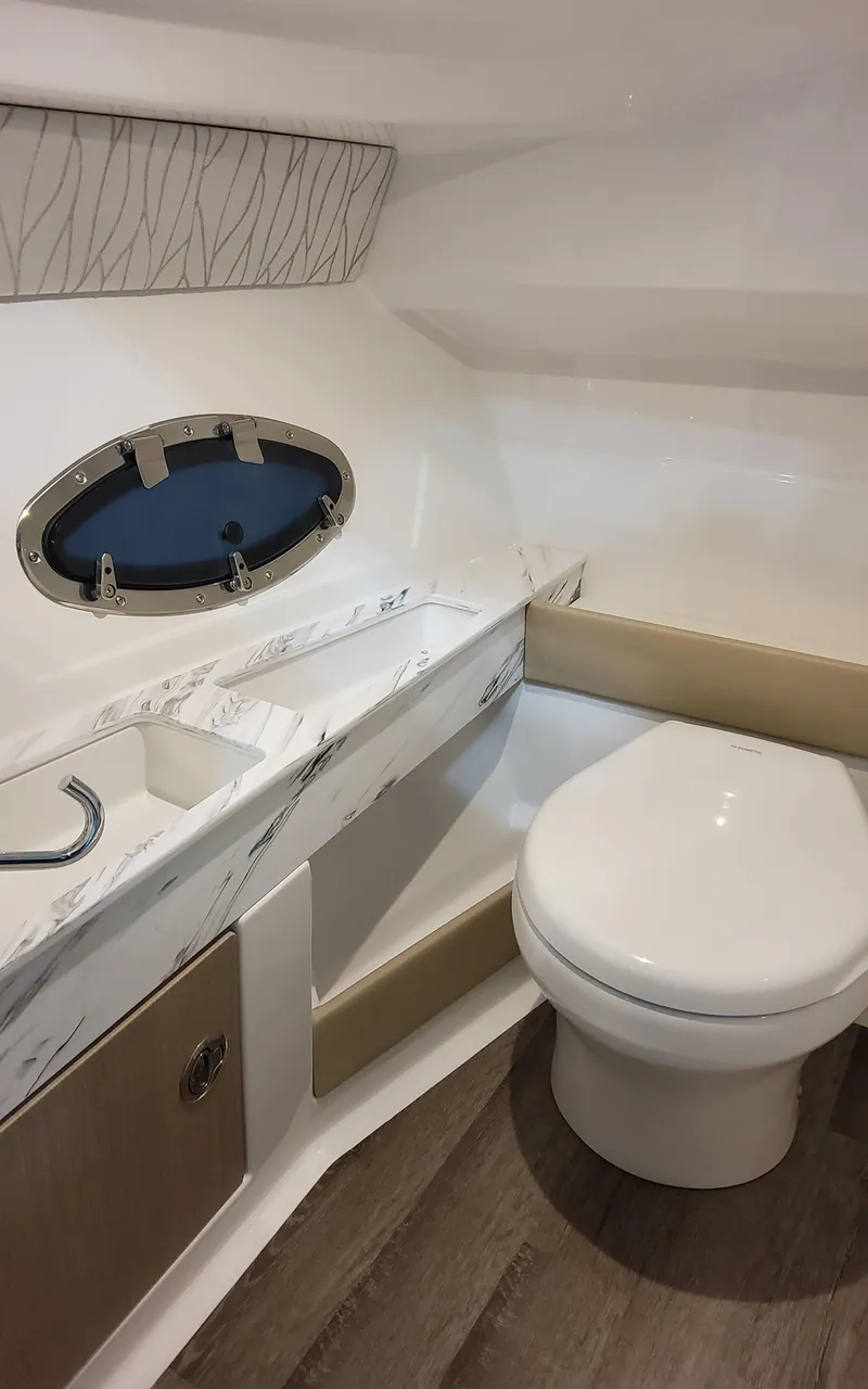 Slide: The Image of 2026 Formula 290 Bowrider interior bathroom with modern fixtures and sleek design. - 14