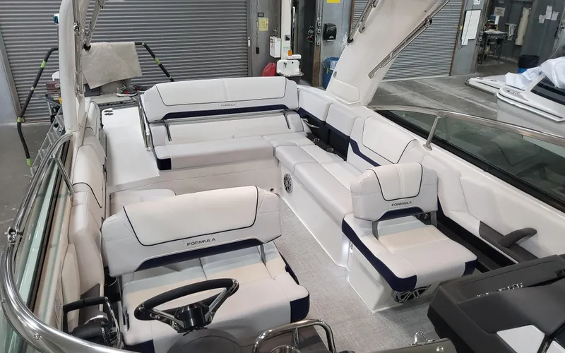 Slide: The Image of 2026 Formula 290 Bowrider interior with luxurious white seating and modern design. - 17