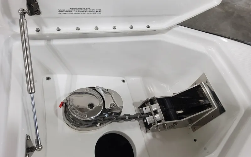 Slide: The Image of Anchor compartment of 2026 Formula 290 Bowrider with winch and chain mechanism. - 19