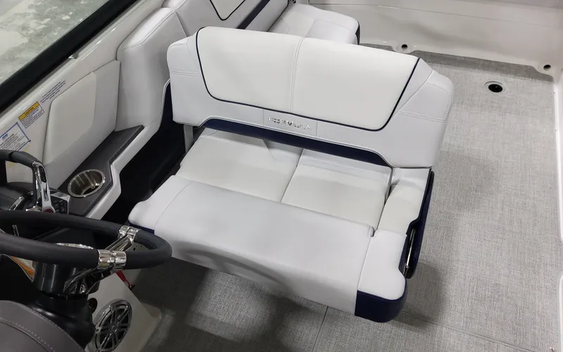 Slide: The Image of 2026 Formula 290 Bowrider interior with white seating and steering wheel. - 23