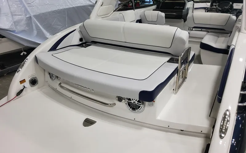 Slide: The Image of 2026 Formula 290 Bowrider boat interior with white seating and modern design. - 6