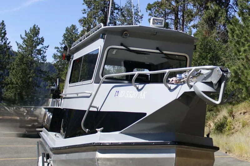 Slide: The Image of 2005 ACB 27 boat parked in a forested area, showcasing its sturdy design. - 10
