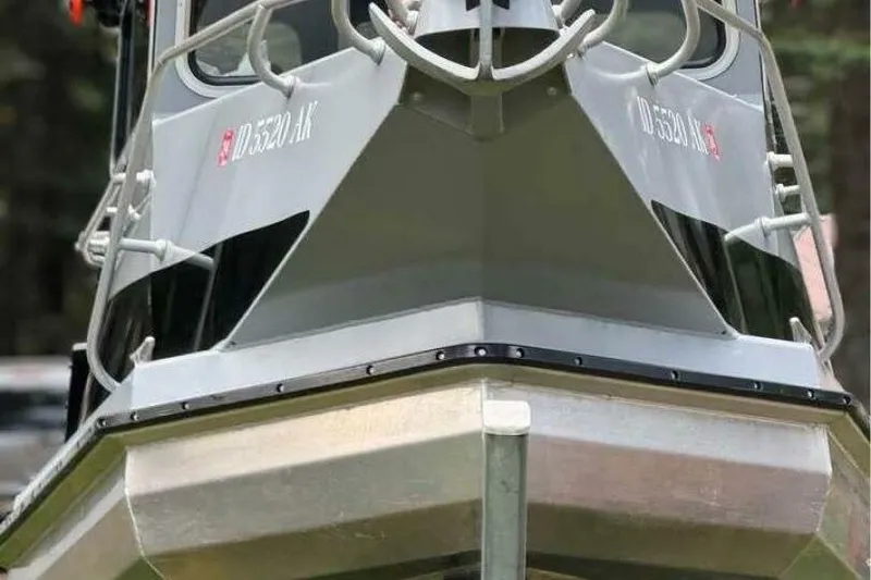 Slide: The Image of Front view of a 2005 ACB 27 boat with visible registration numbers. - 12