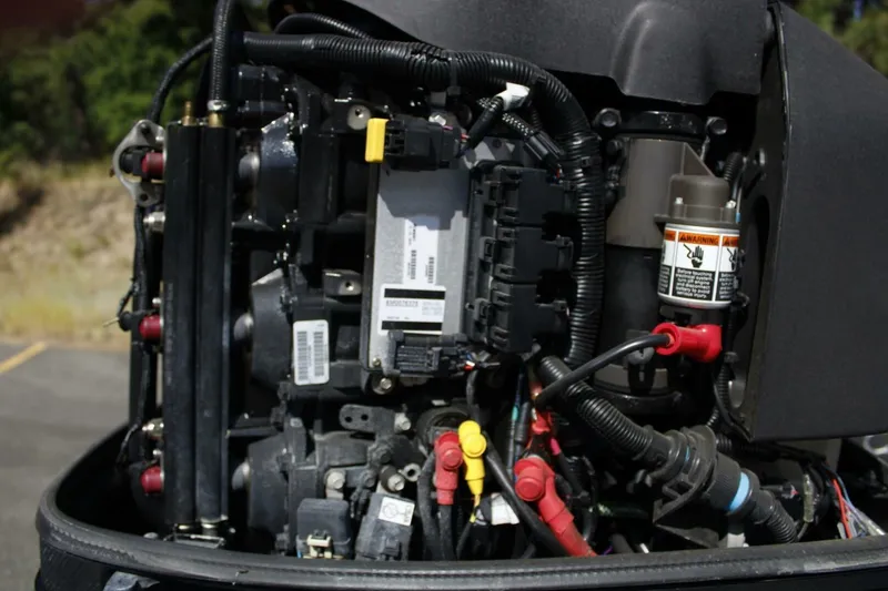 Slide: The Image of Close-up of ACB 27 engine components, 2005 model, showcasing wiring and mechanical parts. - 25