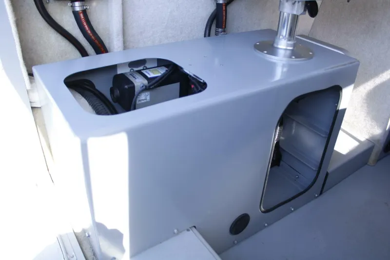 Slide: The Image of Interior view of a 2005 ACB 27 boat, showcasing storage compartment and equipment. - 37