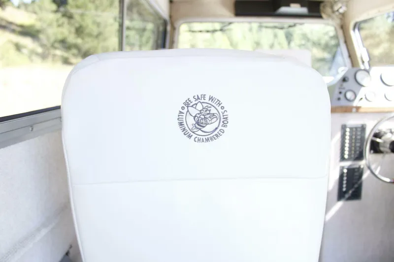 Slide: The Image of White boat seat with logo, inside ACB 27 model, 2005. - 39