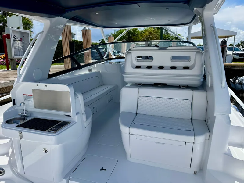 Slide: The Image of Luxurious interior of 2026 Intrepid 438 Evolution yacht with seating and kitchenette. - 10
