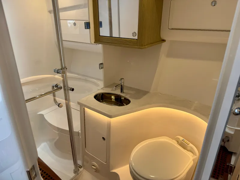 Slide: The Image of Luxurious bathroom in 2026 Intrepid 438 Evolution yacht, featuring modern fixtures and ambient lighting. - 16