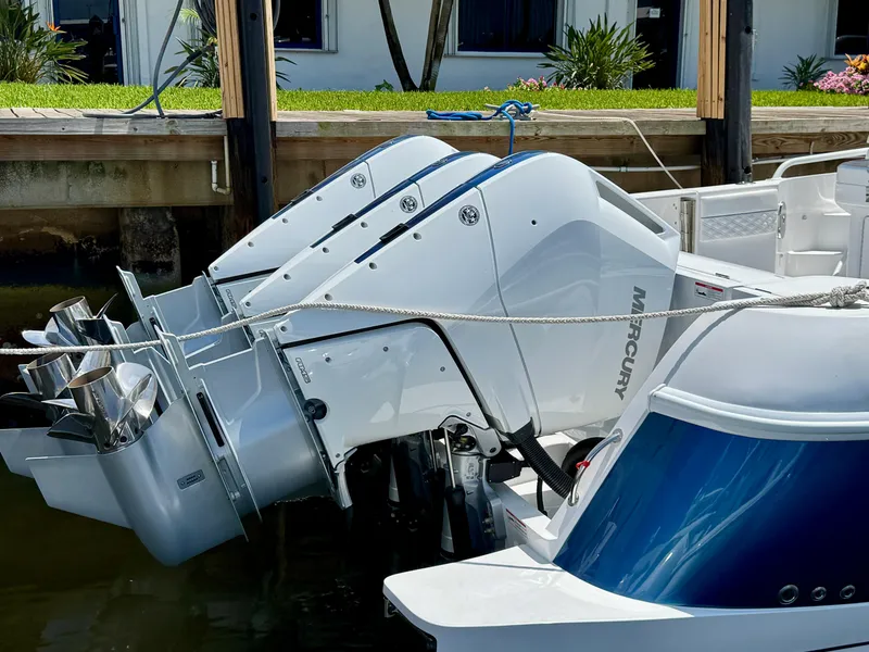 Slide: The Image of 2026 Intrepid 438 Evolution boat with powerful Mercury outboard engines docked. - 5