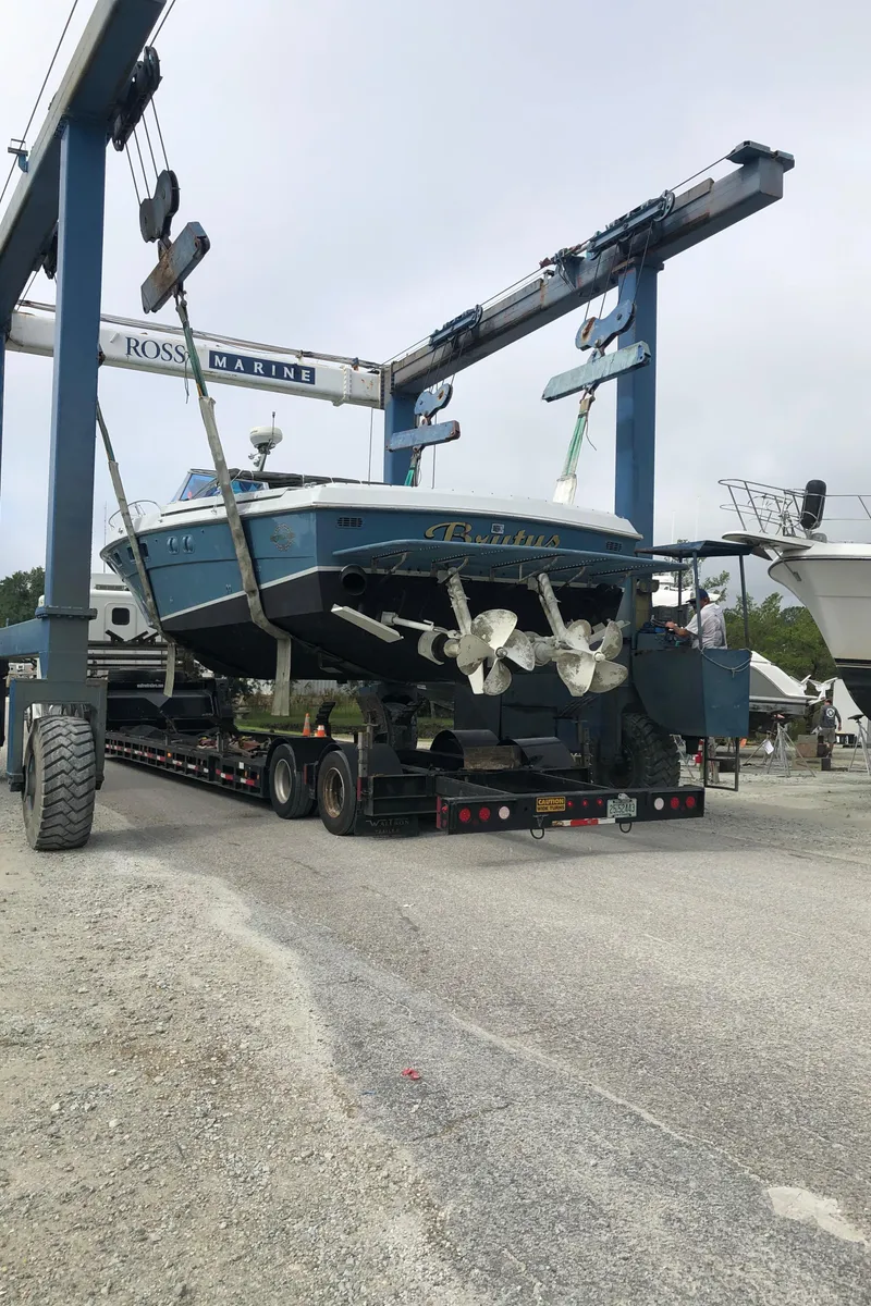 Slide: The Image of 1988 Magnum 40 Sport boat on trailer at Ross Marine facility. - 14