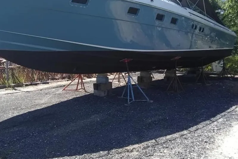 Slide: The Image of 1988 Magnum 40 Sport yacht on stands, side view, outdoors. - 17