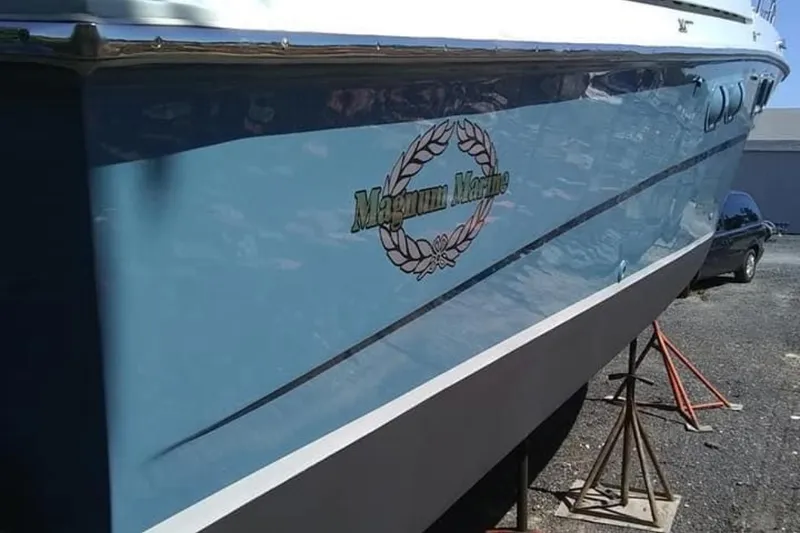 Slide: The Image of 1988 Magnum 40 Sport boat on stands, displaying "Magnum Marine" logo. - 19