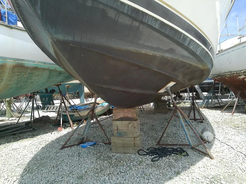 Slide: The Image of 2000 Tiara Yachts 3100 Open on dry dock, supported by stands and blocks. - 20