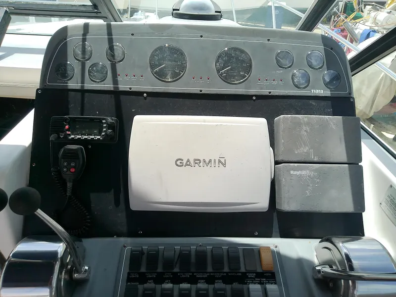 Slide: The Image of Control panel of a 2000 Tiara Yachts 3100 Open with Garmin navigation system. - 32