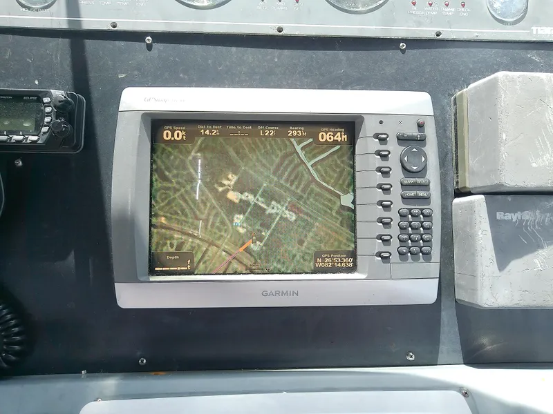Slide: The Image of Garmin GPS navigation system on 2000 Tiara Yachts 3100 Open dashboard. - 36