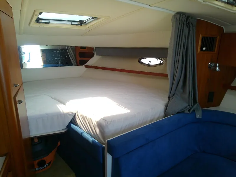 Slide: The Image of 2000 Tiara Yachts 3100 Open cabin interior with bed and seating area. - 45