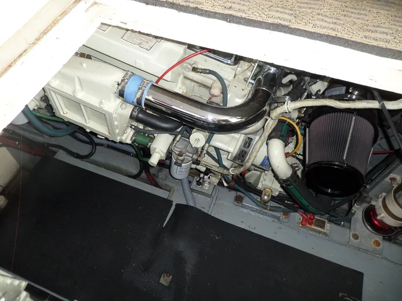 Slide: The Image of Engine compartment of a 1987 Hatteras 42 Convertible boat, showcasing mechanical components. - 40