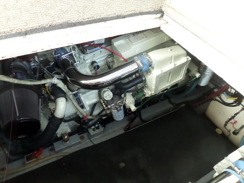 Slide: The Image of Engine compartment of a 1987 Hatteras 42 Convertible boat, showcasing mechanical components. - 41
