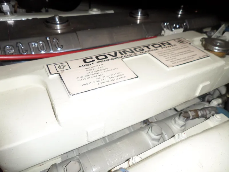 Slide: The Image of Engine of 1987 Hatteras 42 Convertible with Covington high-performance marine power label. - 42