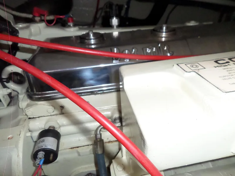 Slide: The Image of Engine compartment of 1987 Hatteras 42 Convertible with visible wiring and components. - 43